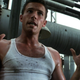 A glistening Ben Affleck wears a dirty undershirt in front of some pipes in Armageddon.